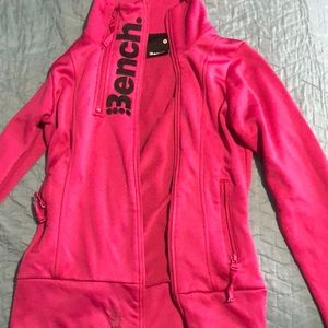 Ladies bench sweater. Does have a rip at the bottom of it, but still wearable